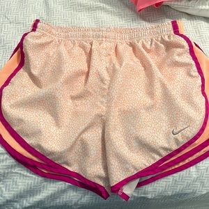 Orange and purple Nike shorts